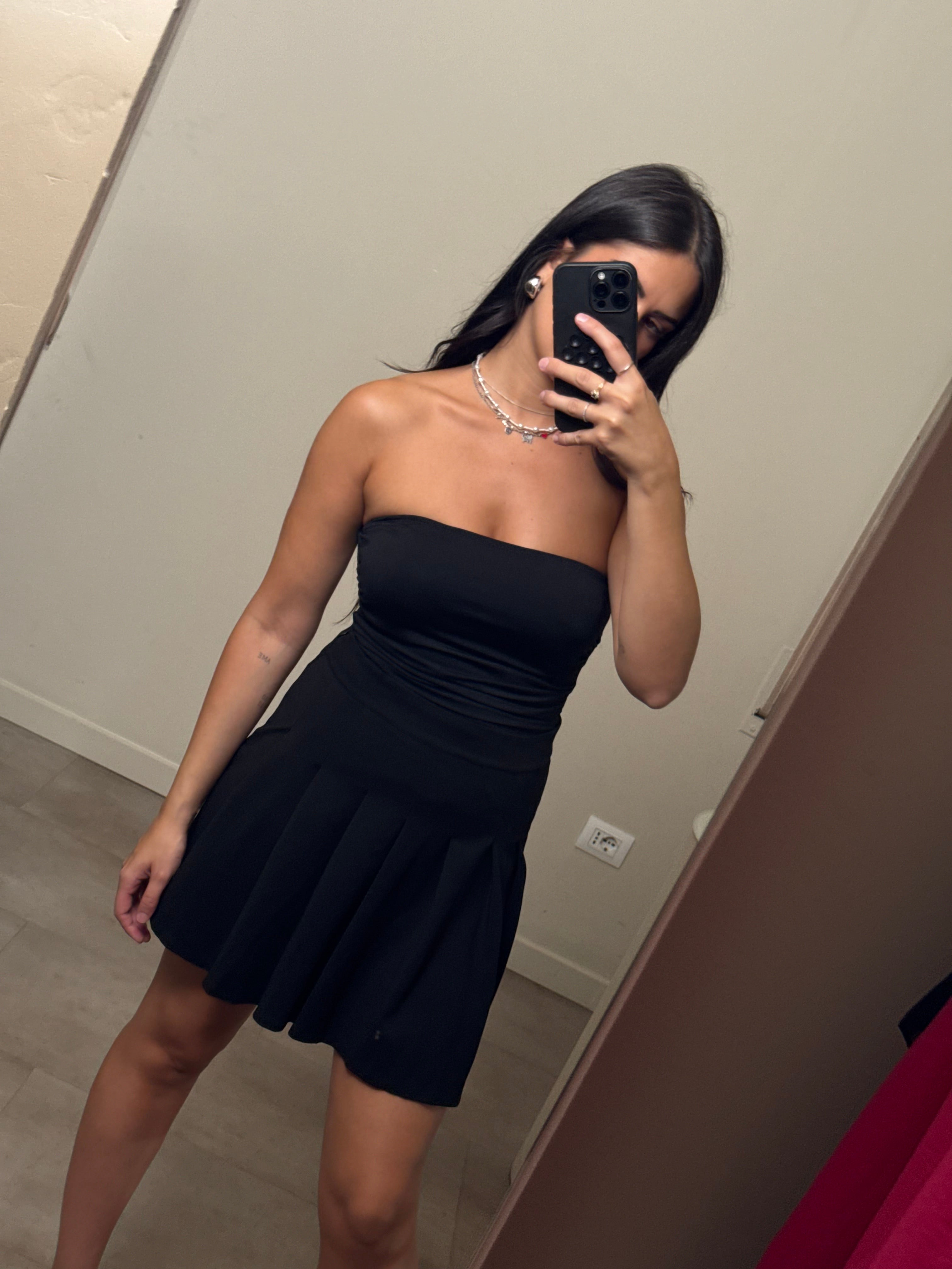 Mini gonna nera a pieghe